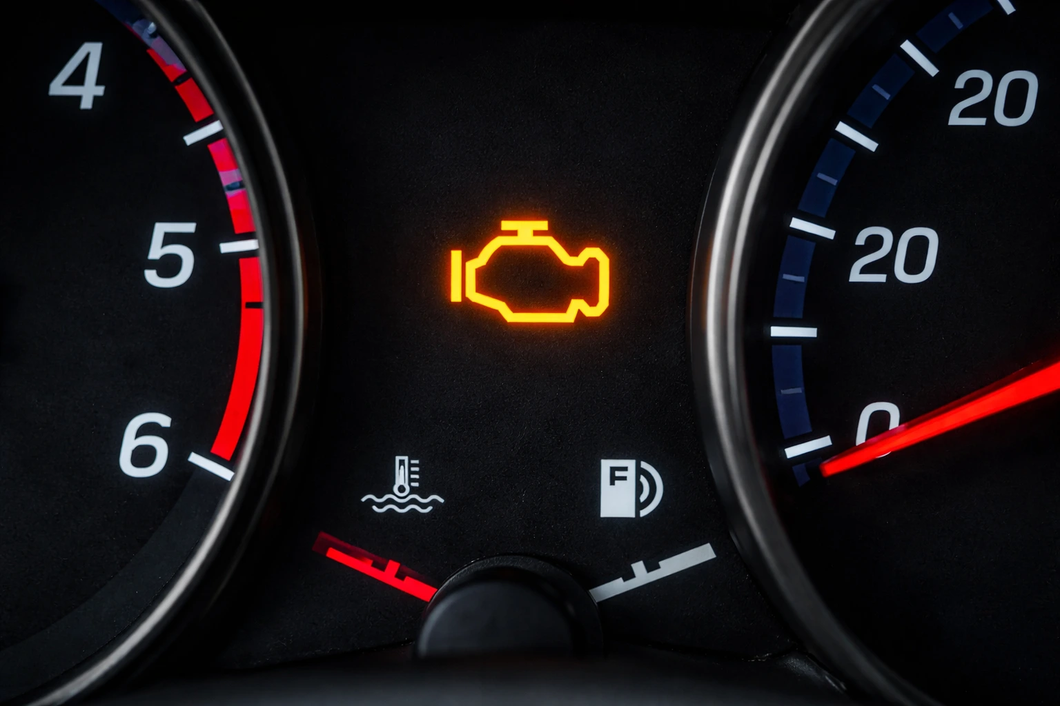 photo of an engine warning light on a dashboard